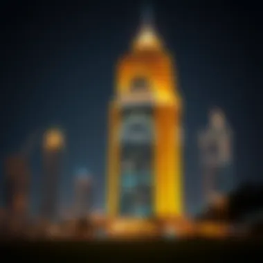Night view of the Dubai National Insurance Building illuminated against the city skyline.
