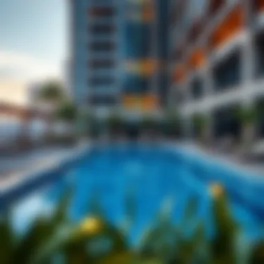Stylish outdoor pool area at Oasis Tower 2 featuring elegant seating and lush landscaping
