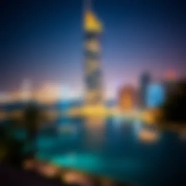 Night view of the Sea Tower illuminated against the Dubai skyline