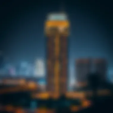 Night view of Windsor Manor Tower illuminated in the Dubai skyline